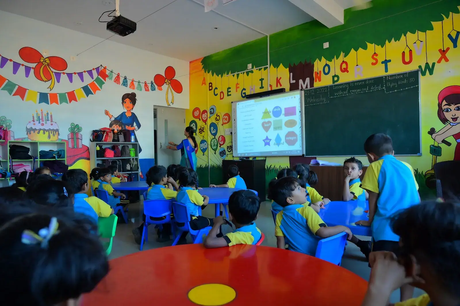 Young learners in a bright, colourful classroom at Janapriya Central School