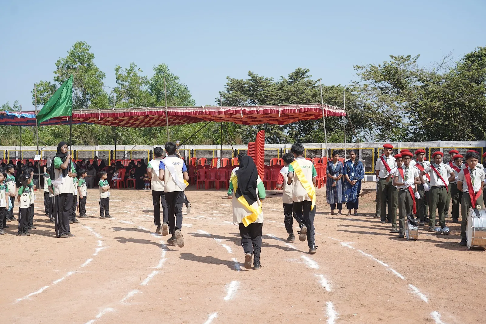 March-past with house flags on Sports Day at JCS